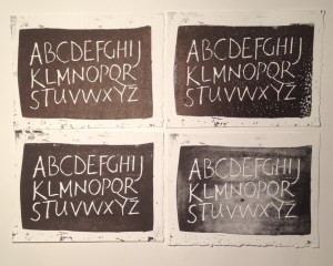 Freely written alphabet cut in wood and printed letterpress